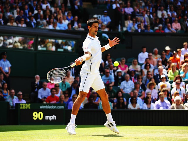 Novak Djokovic of Serbia plays a forehand return during his Gentlemen's Singles third round match against Gilles Simon of France on day five of the Wimbledon Lawn Tennis Championships at the All England Lawn Tennis and Croquet Club on June 27, 2014