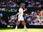 Novak Djokovic of Serbia plays a forehand return during his Gentlemen's Singles third round match against Gilles Simon of France on day five of the Wimbledon Lawn Tennis Championships at the All England Lawn Tennis and Croquet Club on June 27, 2014