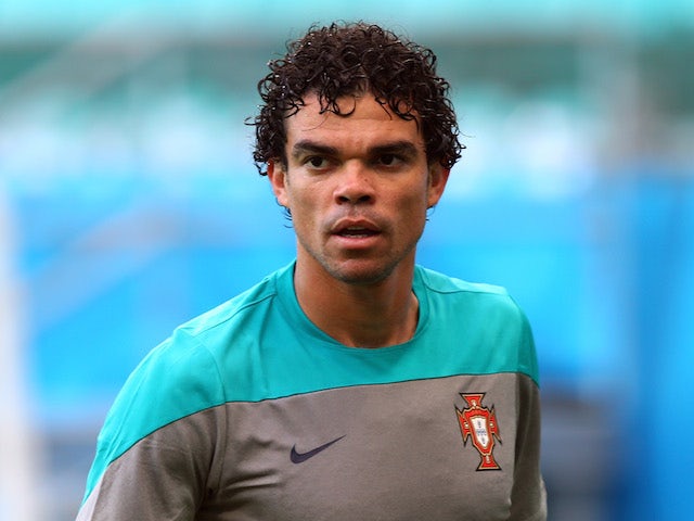 Pepe reacts during the Portugal training session ahead of the 2014 FIFA World Cup Group G match between Germany and Portugal held at the Arena Fonte Nova on June 15, 2014