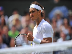 Nadal through after early scare
