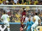 Russia's forward Alexander Kokorin scores his team's first goal past Algeria's goalkeeper Rais Mbohli during a Group H football match between Algeria and Russia at the Baixada Arena in Curitiba during the 2014 FIFA World Cup on June 26, 2014