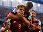 Alexander Kokorin of Russia celebrates scoring his team's first goal with teammate Oleg Shatov on his back during the 2014 FIFA World Cup Brazil Group H match between Algeria and Russia at Arena da Baixada on June 26, 2014