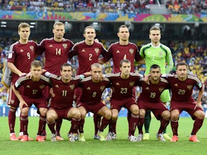 Russia pose for a team photo prior to the 2014 FIFA World Cup Brazil Group H match between Algeria and Russia at Arena da Baixada on June 26, 2014