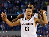 Shabazz Napier #13 of the Connecticut Huskies celebrates on the court after defeating the Kentucky Wildcats 60-54 in the NCAA Men's Final Four Championship on April 7, 2014