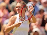 Romania's Simona Halep celebrates beating Ukraine's Lesia Tsurenko during their women's singles second round match on day five of the 2014 Wimbledon Championships at The All England Tennis Club in Wimbledon, southwest London, on June 27, 2014