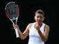 Simona Halep of Romania during her Ladies' Singles third round match against Belinda Bencic of Switzerland on day six of the Wimbledon Lawn Tennis Championships at the All England Lawn Tennis and Croquet Club at Wimbledon on June 28, 2014