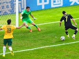 David Villa of Spain scores his team's first goal with a back heel past Mathew Ryan of Australia during the 2014 FIFA World Cup Brazil Group B match between Australia and Spain at Arena da Baixada on June 23, 2014 