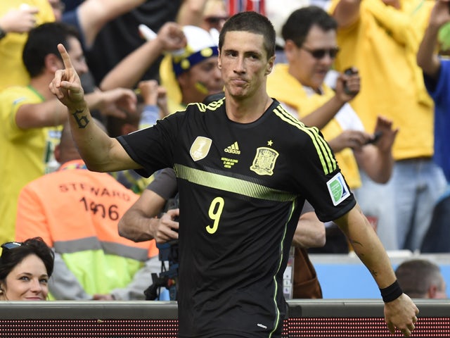 Spain's forward Fernando Torres celebrates after scoring his team's second goal during a Group B match between Australia and Spain at the Baixada Arena in Curitiba during the 2014 FIFA World Cup on June 23, 2014