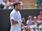 Switzerland's Stanislas Wawrinka reacts after a point against Portugal's Joao Sousa during their men's singles first round match on day two of the 2014 Wimbledon Championships at The All England Tennis Club in Wimbledon, southwest London, on June 24, 2014