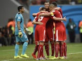 Switzerland's players celebrate after scoring their third goal during the Group E football match between Honduras and Switzerland at the Amazonia Arena in Manaus during the 2014 FIFA World Cup on June 25, 2014