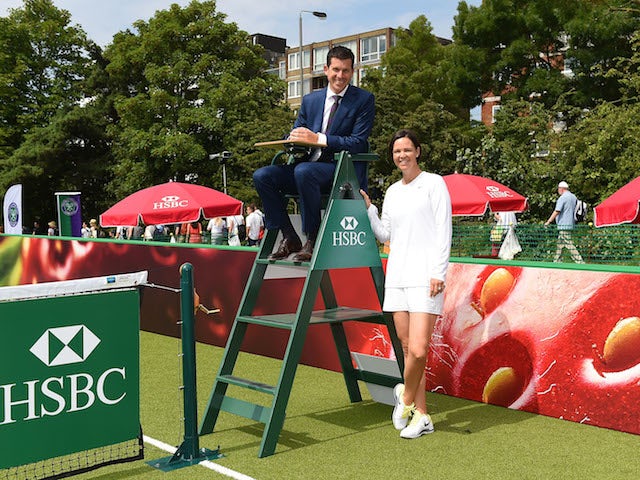 HSBC ambassadors, former British No.1, Tim Henman and former Wimbledon Champion Lindsay Davenport pose for photos at HSBC Court 20 on day one of The Championships on June 23, 2014