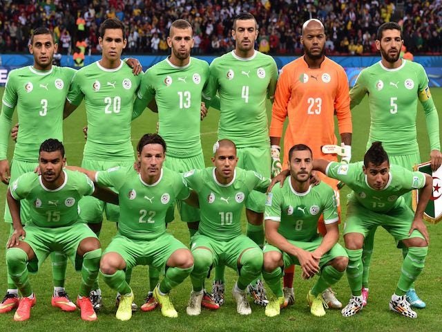 Algeria's players lineup prior to the game with Germany on June 30, 2014
