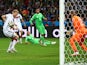 Andre Schuerrle of Germany scores his team's first goal past goalkeeper Rais M'Bolhi of Algeria in extra time during the 2014 FIFA World Cup on June 30, 2014