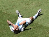 Argentina's midfielder Angel Di Maria lies on the ground during a quarter-final football match against Belgium on July 5, 2014
