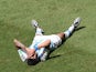 Argentina's midfielder Angel Di Maria lies on the ground during a quarter-final football match against Belgium on July 5, 2014