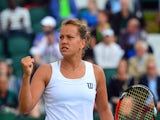 Czech Republic's Barbora Zahlavova Strycova reacts to winning a point against Denmark's Caroline Wozniacki during their women's singles fourth round match on day seven of the 2014 Wimbledon Championships at The All England Tennis Club in Wimbledon, southw