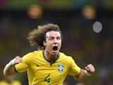 Brazil's defender David Luiz celebrates scoring during the quarter-final football match between Brazil and Colombia at the Castelao Stadium in Fortaleza during the 2014 FIFA World Cup on July 4, 2014