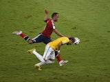 Colombia's defender Juan Camilo Zuniga challenges Brazil's forward Neymar during the quarter-final football match between Brazil and Colombia at the Castelao Stadium in Fortaleza during the 2014 FIFA World Cup on July 4, 2014