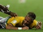Brazil's forward Neymar lies on the pitch after being injured during the quarter-final football match between Brazil and Colombia at the Castelao Stadium in Fortaleza during the 2014 FIFA World Cup on July 4, 2014
