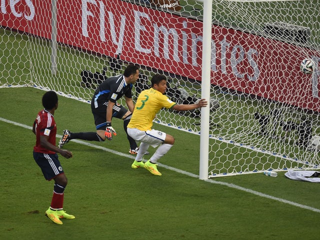 Brazil's defender and captain Thiago Silva reacts after scoring a goal during the quarter-final football match between Brazil and Colombia at the Castelao Stadium in Fortaleza during the 2014 FIFA World Cup on July 4, 2014