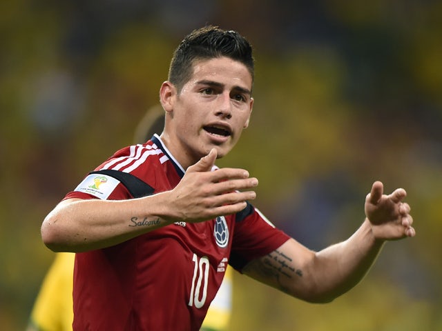Colombia's midfielder James Rodriguez celebrates after scoring during the quarter-final football match between Brazil and Colombia at the Castelao Stadium in Fortaleza during the 2014 FIFA World Cup on July 4, 2014