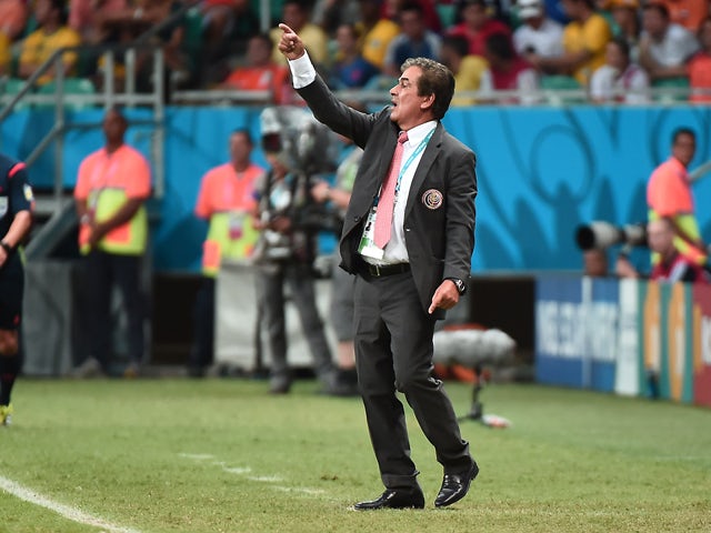 Costa Rica's Colombian coach Jorge Luis Pinto gestures during a quarter-final football match between Netherlands and Costa Rica at the Fonte Nova Arena in Salvador during the 2014 FIFA World Cup on July 5, 2014