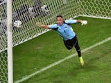 Costa Rica's goalkeeper Keylor Navas jumps to make a save during a quarter-final football match between Netherlands and Costa Rica at the Fonte Nova Arena in Salvador during the 2014 FIFA World Cup on July 5, 2014