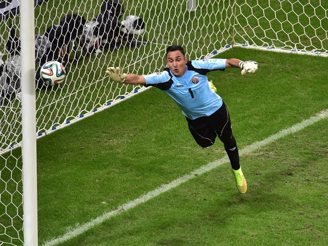 Costa Rica's goalkeeper Keylor Navas jumps to make a save during a quarter-final football match between Netherlands and Costa Rica at the Fonte Nova Arena in Salvador during the 2014 FIFA World Cup on July 5, 2014