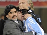 Argentina's coach Diego Maradona hugs Argentina's striker Lionel Messi after the 2010 World Cup quarter final Argentina vs Germany on July 3, 2010 