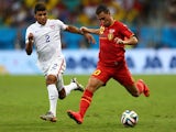 Eden Hazard of Belgium controls the ball as DeAndre Yedlin of the United States gives chase during the 2014 FIFA World Cup Brazil Round of 16 match on July 1, 2014