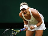 Eugenie Bouchard of Canada celebrates after winning her Ladies' Singles fourth round match against Alize Cornet of France on day seven of the Wimbledon Lawn Tennis Championships at the All England Lawn Tennis and Croquet Club on June 30, 2014