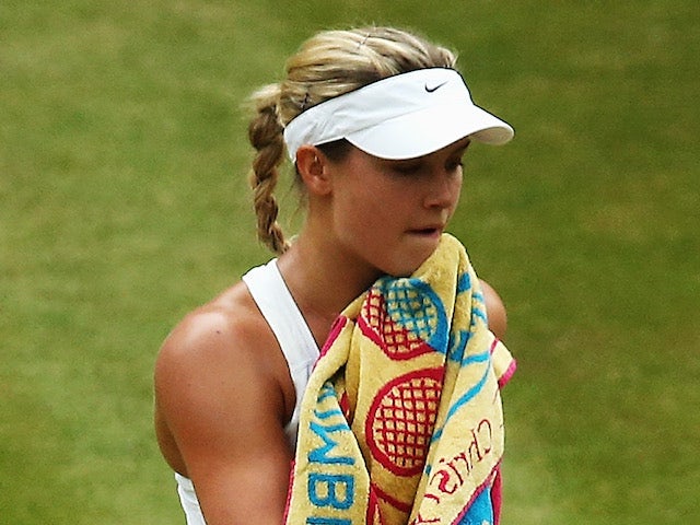 Eugenie Bouchard of Canada stands dejected during the Ladies' Singles final match against Petra Kvitova on July 5, 2014