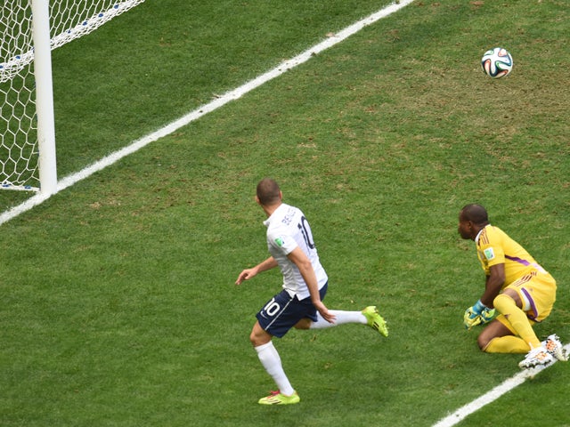 France's forward Karim Benzema makes a failed attempt at goal next to Nigeria's goalkeeper Vincent Enyeama during a Round of 16 football match between France and Nigeria at Mane Garrincha National Stadium in Brasilia during the 2014 FIFA World Cup on June