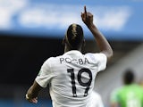 France's midfielder Paul Pogba celebrates after scoring the first goal during a Round of 16 football match between France and Nigeria at Mane Garrincha National Stadium in Brasilia during the 2014 FIFA World Cup on June 30, 2014