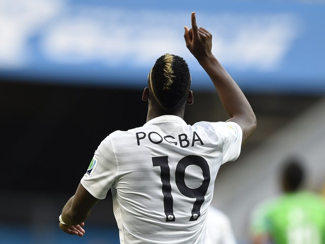 France's midfielder Paul Pogba celebrates after scoring the first goal during a Round of 16 football match between France and Nigeria at Mane Garrincha National Stadium in Brasilia during the 2014 FIFA World Cup on June 30, 2014
