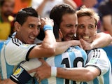 Argentina striker Gonzalo Higuain celebrates with teammates Angel Di Maria, Lionel Messi and Lucas Biglia after scoring the opening goal against Belgium in the 2014 World Cup quarter-final in Brasilia on July 5, 2014