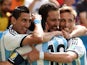Argentina striker Gonzalo Higuain celebrates with teammates Angel Di Maria, Lionel Messi and Lucas Biglia after scoring the opening goal against Belgium in the 2014 World Cup quarter-final in Brasilia on July 5, 2014