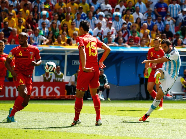 Gonzalo Higuain of Argentina scores his team's first goal during the 2014 FIFA World Cup Brazil Quarter Final match against Belgium on July 5, 2014