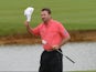  Graeme McDowell of Northern Ireland acknowledges the crowd after finishing his round on the 18th green during the Alstom Open de France - Day Four at Le Golf National on July 6, 2014