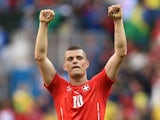 Switzerland's midfielder Granit Xhaka celebrates their victory at the end of a Group E football match between Switzerland and Ecuador at the Mane Garrincha National Stadium in Brasilia during the 2014 FIFA World Cup on June 15, 2014