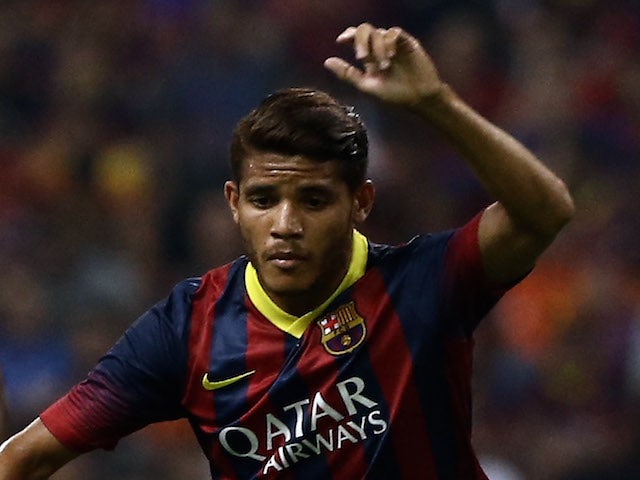 Jonathan dos Santos of Barcelona FC dribbles during the friendly match between FC Barcelona and Malaysia at Shah Alam Stadium on August 10, 2013