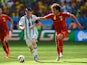 Lionel Messi of Argentina is challenged by Axel Witsel of Belgium (R) during the 2014 FIFA World Cup Brazil Quarter Final match on July 5, 2014