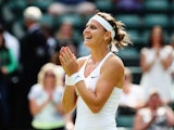  Lucie Safarova of Czech Republic celebrates winning her Ladies' Singles quarter-final match against Ekaterina Makarova of Russia on day eight of the Wimbledon Lawn Tennis Championships at the All England Lawn Tennis and Croquet Club on July 1, 2014