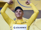 Germany's Marcel Kittel celebrates his yellow jersey received from Britain's Catherine, Duchess of Cambridge on the podium on July 5, 2014