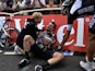 Britain's Mark Cavendish injured receives medical assistance after a fall near the finish line at the end of the 190.5 km first stage of the 101st edition of the Tour de France on July 5, 2014