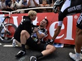 Britain's Mark Cavendish injured receives medical assistance after a fall near the finish line at the end of the 190.5 km first stage of the 101st edition of the Tour de France on July 5, 2014