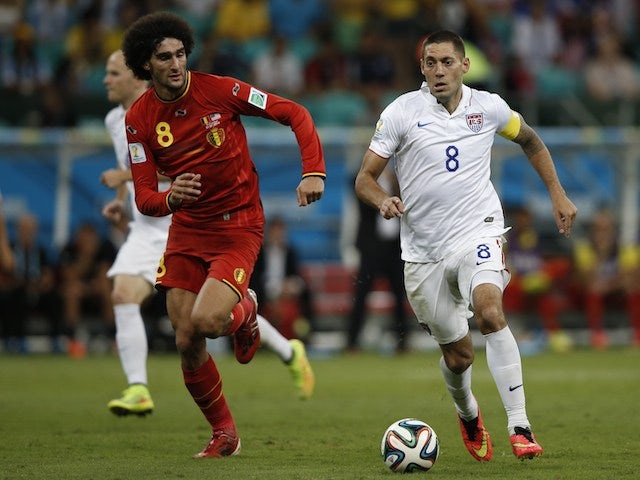 Belgium's midfielder Marouane Fellaini (L) challenges US forward Clint Dempsey for the ball during the Round of 16 football match on July 1, 2014