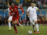 Belgium's midfielder Marouane Fellaini (L) challenges US forward Clint Dempsey for the ball during the Round of 16 football match on July 1, 2014