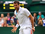 Croatia's Marin Cilic celebrates on defeating France's Jeremy Chardy during their men's singles fourth round match on day seven of the 2014 Wimbledon Championships at The All England Tennis Club in Wimbledon, southwest London, on June 30, 2014