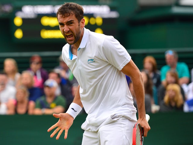 Croatia's Marin Cilic celebrates on defeating France's Jeremy Chardy during their men's singles fourth round match on day seven of the 2014 Wimbledon Championships at The All England Tennis Club in Wimbledon, southwest London, on June 30, 2014